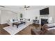 Comfortable living room featuring a fireplace, hardwood floors, and ample seating at 1537 Fishbone Dr, Johns Island, SC 29455
