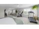 Spacious main bedroom featuring a seating area, exercise equipment, and abundant natural light at 1537 Fishbone Dr, Johns Island, SC 29455