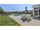 Backyard featuring a pool with a small pond beyond the fence, with table and chairs at 1537 Fishbone Dr, Johns Island, SC 29455