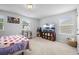 Bright bedroom with carpet features lots of sunlight and decorative bookcase at 167 Cypress Plantation Rd, Moncks Corner, SC 29461