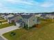 Aerial view of a two-story home with an attached garage and manicured lawn in a suburban neighborhood at 167 Cypress Plantation Rd, Moncks Corner, SC 29461