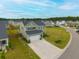Aerial view of a two-story home with an attached garage and manicured lawn in a suburban neighborhood at 167 Cypress Plantation Rd, Moncks Corner, SC 29461