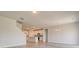 Spacious open-concept living area with modern flooring, leading to a bright kitchen, perfect for entertaining at 167 Cypress Plantation Rd, Moncks Corner, SC 29461