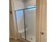 Bright shower features white subway tile, glass door, shower seat, and a small window at 167 Cypress Plantation Rd, Moncks Corner, SC 29461