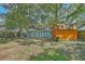 Large backyard features a shed and a partial view of the home's exterior at 184 Tabby Creek Cir, Summerville, SC 29486
