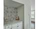 Charming bar area featuring granite countertops, patterned tile backsplash, and well-stocked storage at 184 Tabby Creek Cir, Summerville, SC 29486