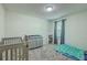 Bedroom bedroom with crib, dresser, sleeping bag and window allowing natural light at 184 Tabby Creek Cir, Summerville, SC 29486