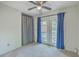 Carpeted bedroom features glass panel doors with blue curtains for natural light at 184 Tabby Creek Cir, Summerville, SC 29486