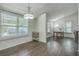 Bright dining area with windows, featuring wood-look flooring, and modern chandelier at 184 Tabby Creek Cir, Summerville, SC 29486