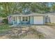 Charming blue single story home with an attached garage and quaint front porch at 184 Tabby Creek Cir, Summerville, SC 29486