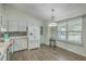 Open kitchen and dining area with stainless steel appliances and sleek granite countertops at 184 Tabby Creek Cir, Summerville, SC 29486