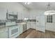 Bright kitchen with stainless appliances, granite counters, and classic white cabinets at 184 Tabby Creek Cir, Summerville, SC 29486