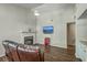 Spacious living room featuring a fireplace, mounted TV, and a cozy leather couch at 184 Tabby Creek Cir, Summerville, SC 29486