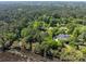 Aerial view of a home in a wooded lot that is set back off the road at 1855 Cherokee Rose Cir, Mount Pleasant, SC 29466