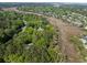 Lush aerial perspective of a beautiful marsh-front community with mature trees at 1855 Cherokee Rose Cir, Mount Pleasant, SC 29466