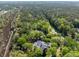 Aerial view of a home in a wooded lot that is set back off the road at 1855 Cherokee Rose Cir, Mount Pleasant, SC 29466