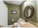 Bathroom features a sink with granite countertop and an oval mirror at 1855 Cherokee Rose Cir, Mount Pleasant, SC 29466