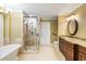 Luxurious bathroom with soaking tub, glass shower, and granite vanity at 1855 Cherokee Rose Cir, Mount Pleasant, SC 29466