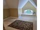 Bedroom featuring an arched window seat area and an area rug with a detailed floral pattern at 1855 Cherokee Rose Cir, Mount Pleasant, SC 29466