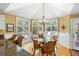 Inviting dining area with views of the deck through expansive windows at 1855 Cherokee Rose Cir, Mount Pleasant, SC 29466