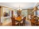 Elegant dining room featuring a large dining table and a beautiful chandelier at 1855 Cherokee Rose Cir, Mount Pleasant, SC 29466