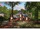 Charming brick home with manicured lawn and lush landscaping, creating a welcoming curb appeal at 1855 Cherokee Rose Cir, Mount Pleasant, SC 29466