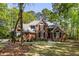 Charming brick home with manicured lawn and lush landscaping, creating a welcoming curb appeal at 1855 Cherokee Rose Cir, Mount Pleasant, SC 29466
