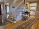 Inviting foyer featuring staircase and hardwood floors, creating a warm and elegant entryway at 1855 Cherokee Rose Cir, Mount Pleasant, SC 29466
