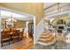 Elegant foyer featuring a staircase and views into the dining and living rooms, inviting and spacious at 1855 Cherokee Rose Cir, Mount Pleasant, SC 29466