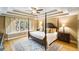 Serene main bedroom featuring a four-poster bed and a trey ceiling at 1855 Cherokee Rose Cir, Mount Pleasant, SC 29466