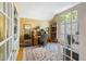 Bright home office with hardwood floors, custom built-ins and doors to let in natural light at 1855 Cherokee Rose Cir, Mount Pleasant, SC 29466
