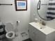 Well-lit bathroom with a toilet and sink, featuring modern fixtures and a clean, functional design at 1866 Ashley Hall Rd, Charleston, SC 29407