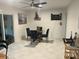 Cozy dining area with a round glass table, four plush chairs, and unique decor at 1866 Ashley Hall Rd, Charleston, SC 29407