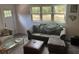 Inviting living room featuring a cozy sofa and a view of the outdoors through a bright window at 1866 Ashley Hall Rd, Charleston, SC 29407