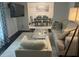 Cozy living room with modern decor, a comfortable seating area, and a dining area in the background at 1866 Ashley Hall Rd, Charleston, SC 29407