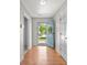 Inviting foyer with hardwood floors, featuring a bright blue front door with decorative wreath at 195 Edinburgh St, Summerville, SC 29483