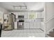 Well-lit kitchen featuring stainless steel appliances, white cabinets, and subway tile backsplash at 195 Edinburgh St, Summerville, SC 29483