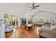 Cozy living room with a fireplace, hardwood floors, and screened in porch at 195 Edinburgh St, Summerville, SC 29483