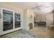 Covered porch with wood floors and ceiling fan, ideal for outdoor seating and relaxation at 195 Edinburgh St, Summerville, SC 29483