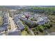 Aerial view of a residential area with well-maintained homes surrounded by nature, near a marsh at 207 Winding River Dr, Johns Island, SC 29455