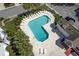 Birds-eye view of the community pool, surrounded by lounge chairs and landscaping, showcasing community amenities at 207 Winding River Dr, Johns Island, SC 29455