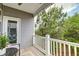 Relaxing back porch with outdoor seating overlooking lush greenery, blending indoor-outdoor living at 207 Winding River Dr, Johns Island, SC 29455