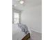 Bright bedroom featuring a wood bedframe, blanket, white walls, carpet and ceiling fan at 207 Winding River Dr, Johns Island, SC 29455