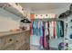 Spacious closet with hanging storage, wire shelving, and wooden dresser with drawers at 207 Winding River Dr, Johns Island, SC 29455