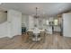 Bright and airy dining area with a stylish chandelier, seamlessly connecting the living room and kitchen at 207 Winding River Dr, Johns Island, SC 29455