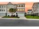 Charming two-story townhouse with manicured lawn, showcasing modern architecture at 207 Winding River Dr, Johns Island, SC 29455