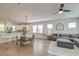 Open-concept living space with stylish decor, a modern ceiling fan, and hardwood flooring at 207 Winding River Dr, Johns Island, SC 29455
