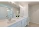 Bright bathroom featuring double sinks, bright lighting, and modern tiling in the shower at 207 Winding River Dr, Johns Island, SC 29455