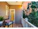 Cozy porch with a comfortable seat, potted plant, and view of the surrounding greenery at 207 Winding River Dr, Johns Island, SC 29455