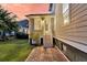 Cozy back entrance with brick pathway, stairs, and a glass-paned door, creating a warm welcome to the home at 2131 Pentland Dr, Charleston, SC 29412